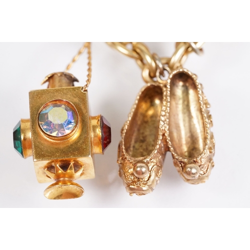 163 - 18ct gold charm bracelet having a curb link chain and spring ring clasp (marked 750), traffic light ... 