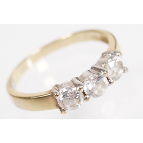 169 - 9ct gold and cz three stone ring (marked 9k, size L.5), together with a pair of sapphire and white s... 
