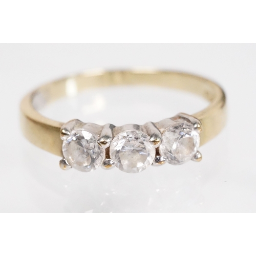 169 - 9ct gold and cz three stone ring (marked 9k, size L.5), together with a pair of sapphire and white s... 