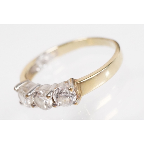 169 - 9ct gold and cz three stone ring (marked 9k, size L.5), together with a pair of sapphire and white s... 
