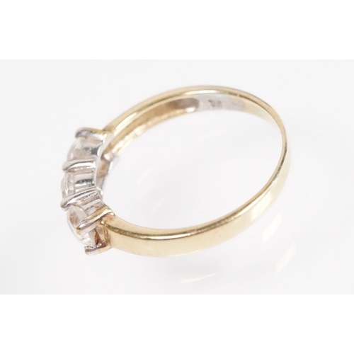 169 - 9ct gold and cz three stone ring (marked 9k, size L.5), together with a pair of sapphire and white s... 