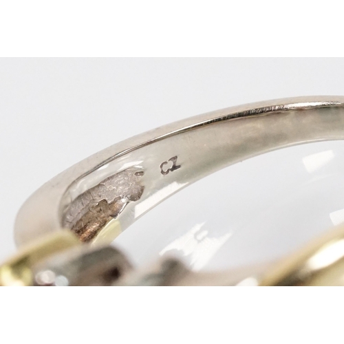 172 - 18ct gold, ruby and sapphire three stone ring. The ring being set with a marquise cut sapphire to ce... 