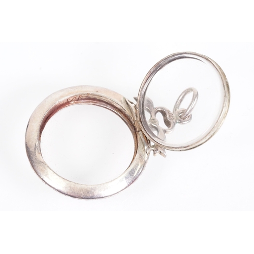 173 - Early 20th Century Edwardian silver and paste locket of round form set with round cut paste stones w... 