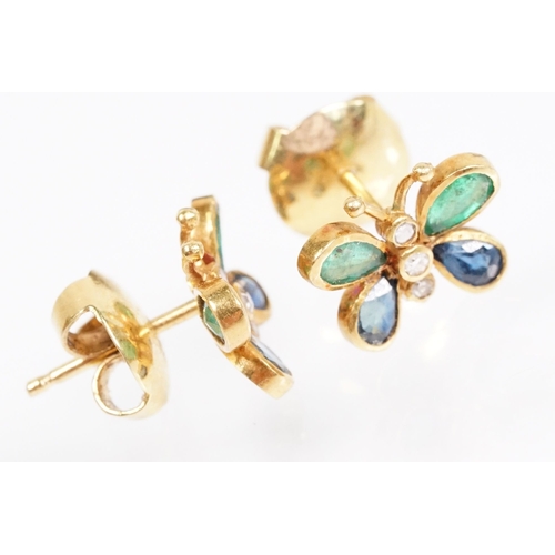 24 - Pair of emerald, sapphire and diamond butterfly stud earrings, each set with two emerald and sapphir... 