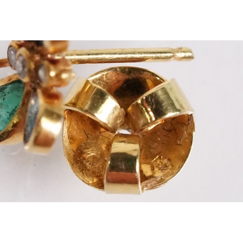 24 - Pair of emerald, sapphire and diamond butterfly stud earrings, each set with two emerald and sapphir... 