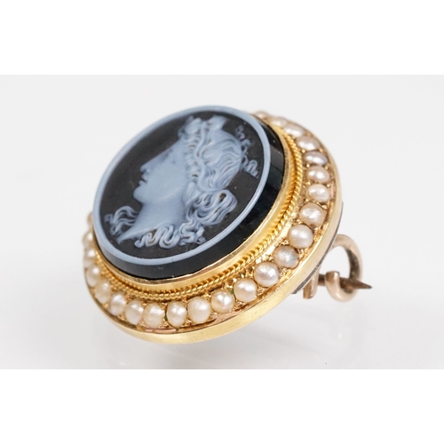 35 - 19th Century Victorian carved black stone cameo brooch being set with a round hand carved cameo port... 