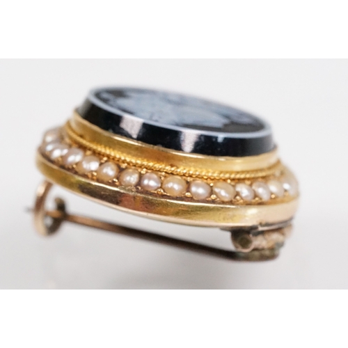 35 - 19th Century Victorian carved black stone cameo brooch being set with a round hand carved cameo port... 