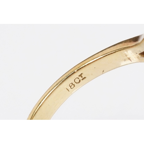 7 - 18ct gold sapphire and diamond halo ring. The ring being set with an oval mixed cut blue sapphire wi... 