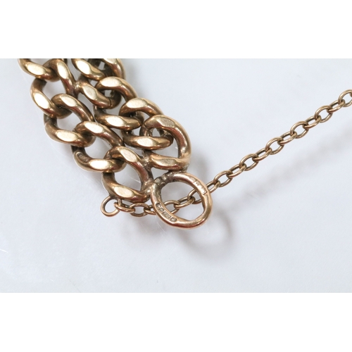 122 - 9ct gold flat link double chain bracelet with dog lead clasp. Hallmarked Birmingham 1979. Measures 9... 