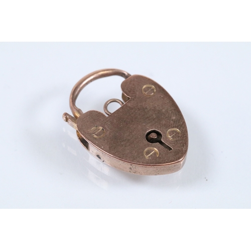151 - 9ct gold heart padlock clasp marked JP, 9ct. Measures 2.2cm. Together with a 9ct gold cross pendant ... 