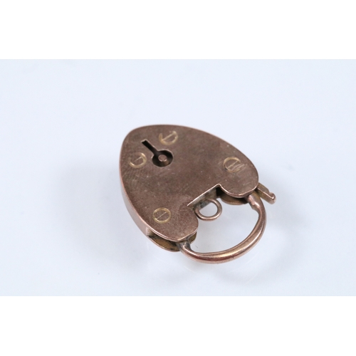 151 - 9ct gold heart padlock clasp marked JP, 9ct. Measures 2.2cm. Together with a 9ct gold cross pendant ... 