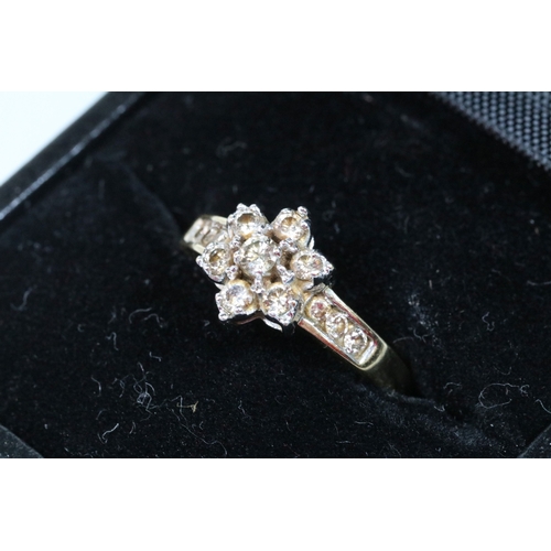174 - 9ct gold and diamond cluster ring. The ring being set with a central cluster of round brilliant cut ... 