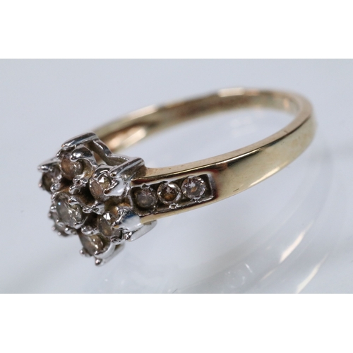 174 - 9ct gold and diamond cluster ring. The ring being set with a central cluster of round brilliant cut ... 