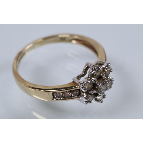 174 - 9ct gold and diamond cluster ring. The ring being set with a central cluster of round brilliant cut ... 