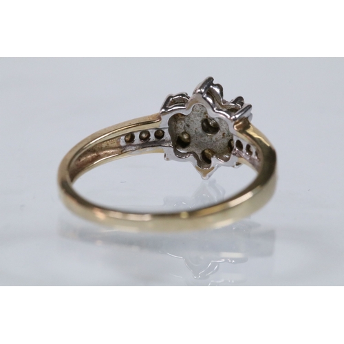 174 - 9ct gold and diamond cluster ring. The ring being set with a central cluster of round brilliant cut ... 