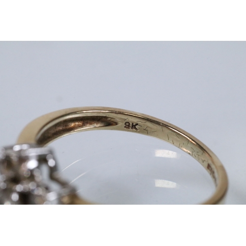 174 - 9ct gold and diamond cluster ring. The ring being set with a central cluster of round brilliant cut ... 