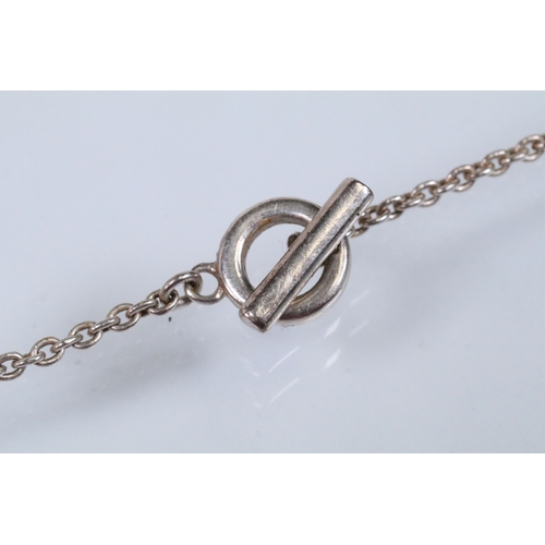 178 - Silver and amethyst pendant necklace having a toggle clasp, together with a silver and synthetic pin... 