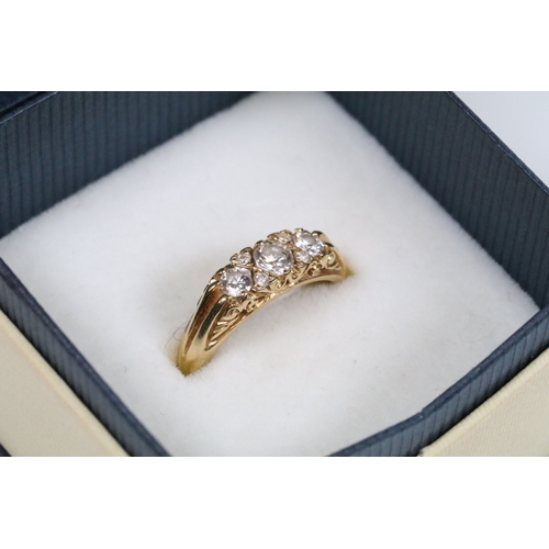 180 - 18ct gold and diamond ring, set with three principle round brilliant cut diamonds with a further fou... 