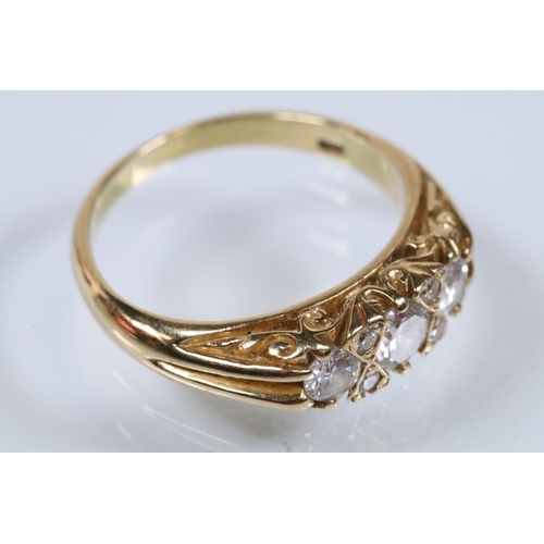 180 - 18ct gold and diamond ring, set with three principle round brilliant cut diamonds with a further fou... 