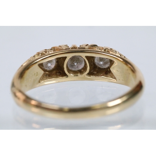 180 - 18ct gold and diamond ring, set with three principle round brilliant cut diamonds with a further fou... 