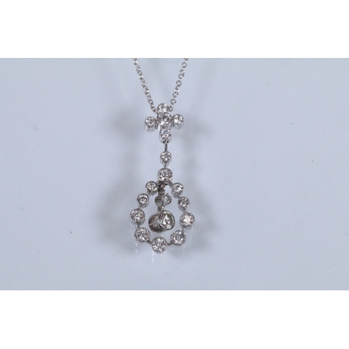 19 - 18ct white gold and diamond pendant necklace. The pendant being bezel set with eighteen round brilli... 