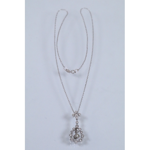 19 - 18ct white gold and diamond pendant necklace. The pendant being bezel set with eighteen round brilli... 