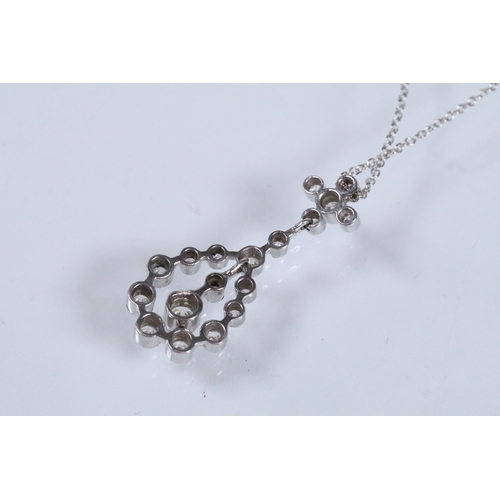 19 - 18ct white gold and diamond pendant necklace. The pendant being bezel set with eighteen round brilli... 