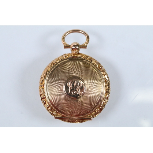 29 - 14ct gold 19th Century engine turned locket pendant. The pendant having a floral engraved border wit... 