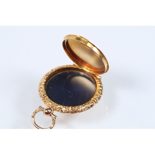 29 - 14ct gold 19th Century engine turned locket pendant. The pendant having a floral engraved border wit... 