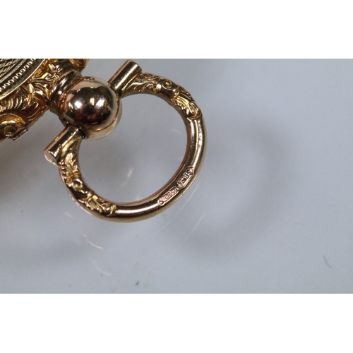 29 - 14ct gold 19th Century engine turned locket pendant. The pendant having a floral engraved border wit... 