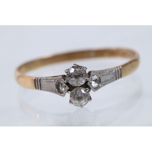 48 - Art Deco 18ct gold and platinum ring being set with two white sapphires to the head flanked by two a... 