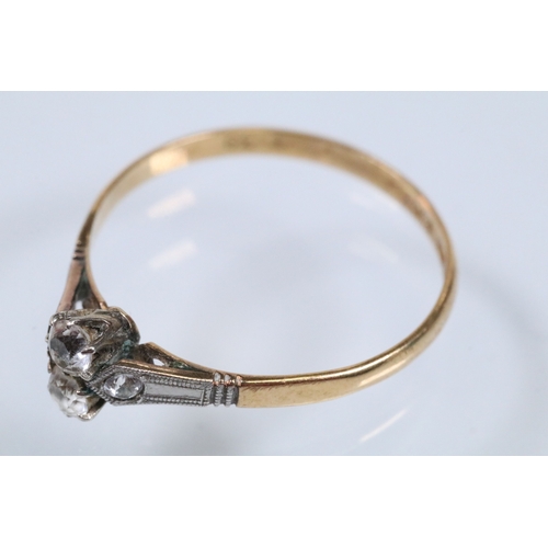 48 - Art Deco 18ct gold and platinum ring being set with two white sapphires to the head flanked by two a... 