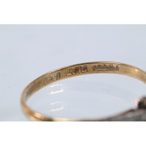 48 - Art Deco 18ct gold and platinum ring being set with two white sapphires to the head flanked by two a... 