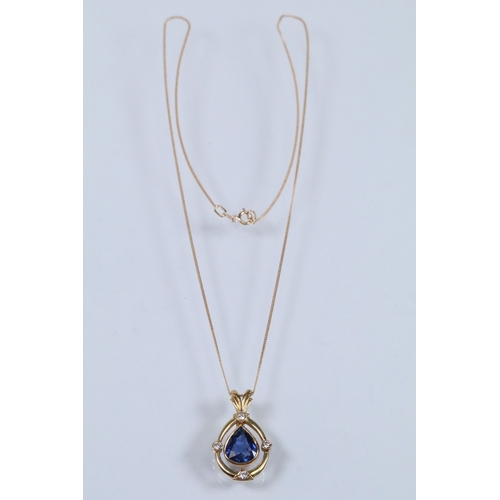 6 - 18ct gold, sapphire and diamond pendant necklace. The necklace being bezel set with a mixed pear cut... 