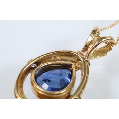 6 - 18ct gold, sapphire and diamond pendant necklace. The necklace being bezel set with a mixed pear cut... 