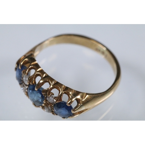 17 - 18ct gold, sapphire and diamond ring being set with three round cut blue sapphires with four diamond... 