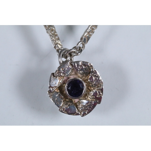 23 - Karina Gill silver and amethyst pendant necklace. The necklace constructed from textured bar links w... 