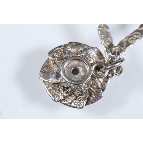 23 - Karina Gill silver and amethyst pendant necklace. The necklace constructed from textured bar links w... 