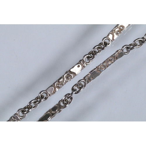 23 - Karina Gill silver and amethyst pendant necklace. The necklace constructed from textured bar links w... 