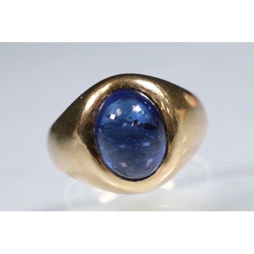 8 - Blue sapphire single stone ring being bezel set with a large blue sapphire cabochon within a yellow ... 
