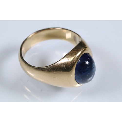 8 - Blue sapphire single stone ring being bezel set with a large blue sapphire cabochon within a yellow ... 