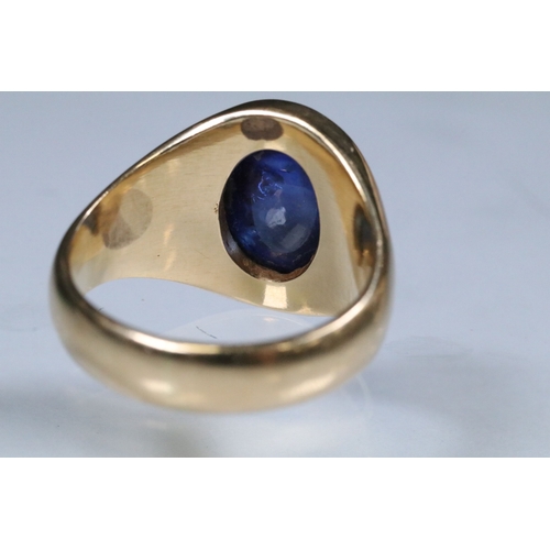 8 - Blue sapphire single stone ring being bezel set with a large blue sapphire cabochon within a yellow ... 