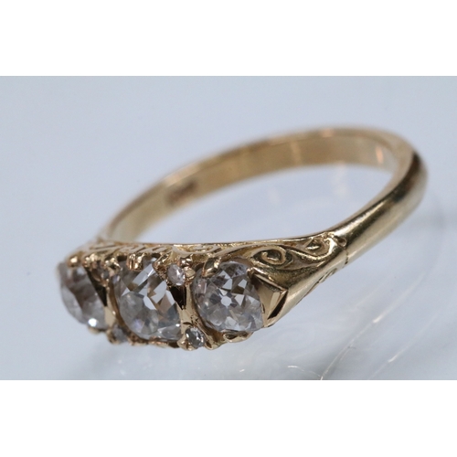 12 - Early 20th Century 18ct gold and diamond three stone ring. The ring being set with three old cushion... 