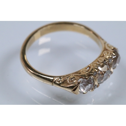 12 - Early 20th Century 18ct gold and diamond three stone ring. The ring being set with three old cushion... 