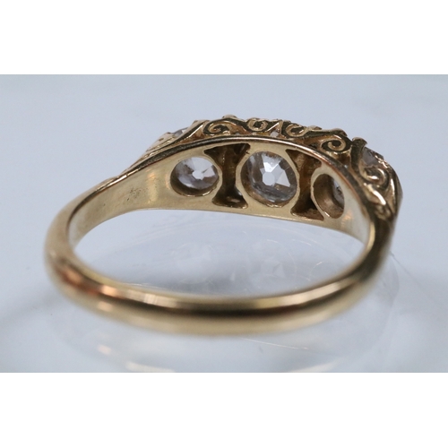 12 - Early 20th Century 18ct gold and diamond three stone ring. The ring being set with three old cushion... 