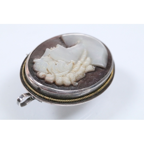 140 - Two 19th Century gold plated lockets to include an engine turned and engraved locket with woven hair... 