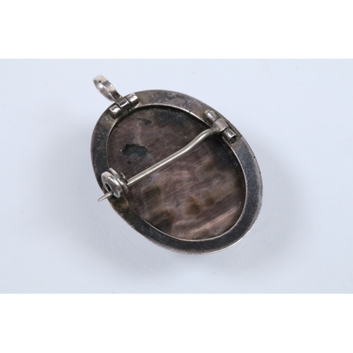 140 - Two 19th Century gold plated lockets to include an engine turned and engraved locket with woven hair... 