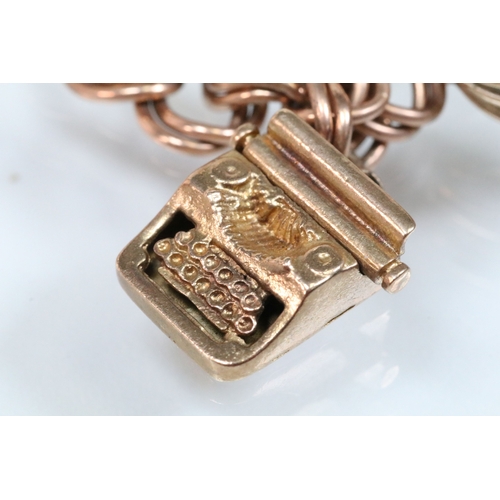 49 - 9ct gold charm bracelet having a double curb link chain. All charms hallmarked apart from carriage, ... 