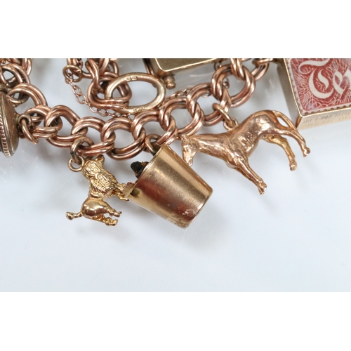 49 - 9ct gold charm bracelet having a double curb link chain. All charms hallmarked apart from carriage, ... 