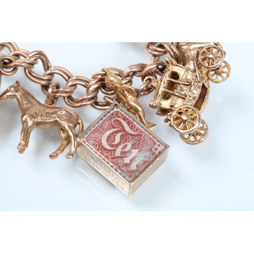 49 - 9ct gold charm bracelet having a double curb link chain. All charms hallmarked apart from carriage, ... 